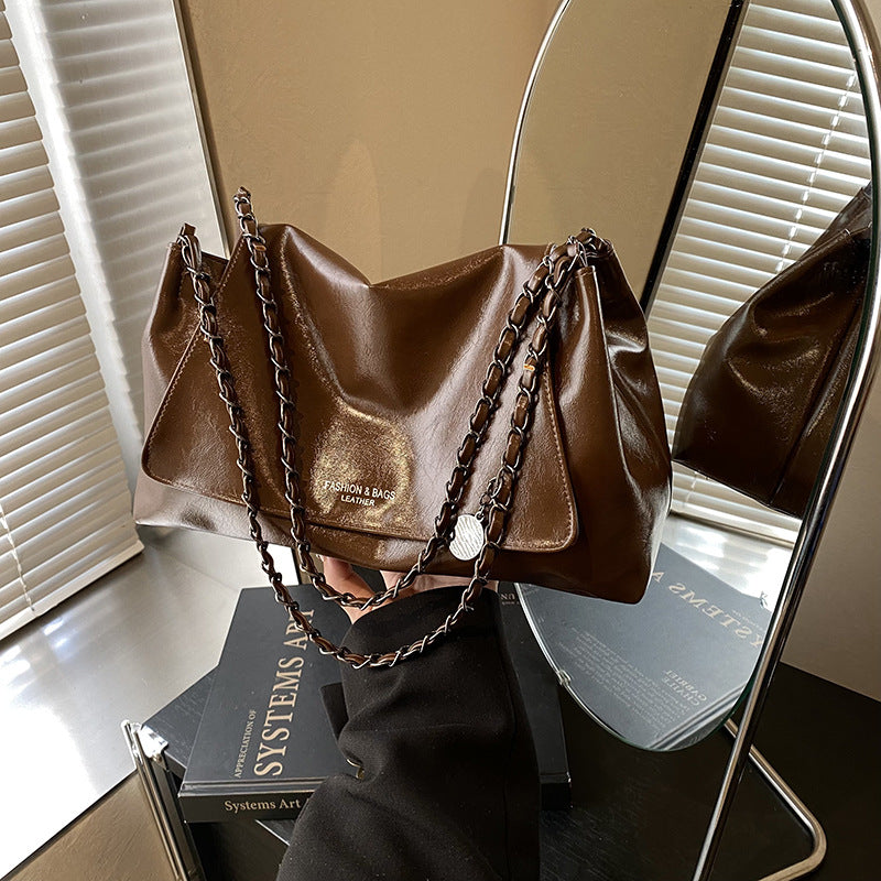 Solid color simple large-capacity foreign gas bag women's 2025 new trendy underarm commuter chain single shoulder tote bag