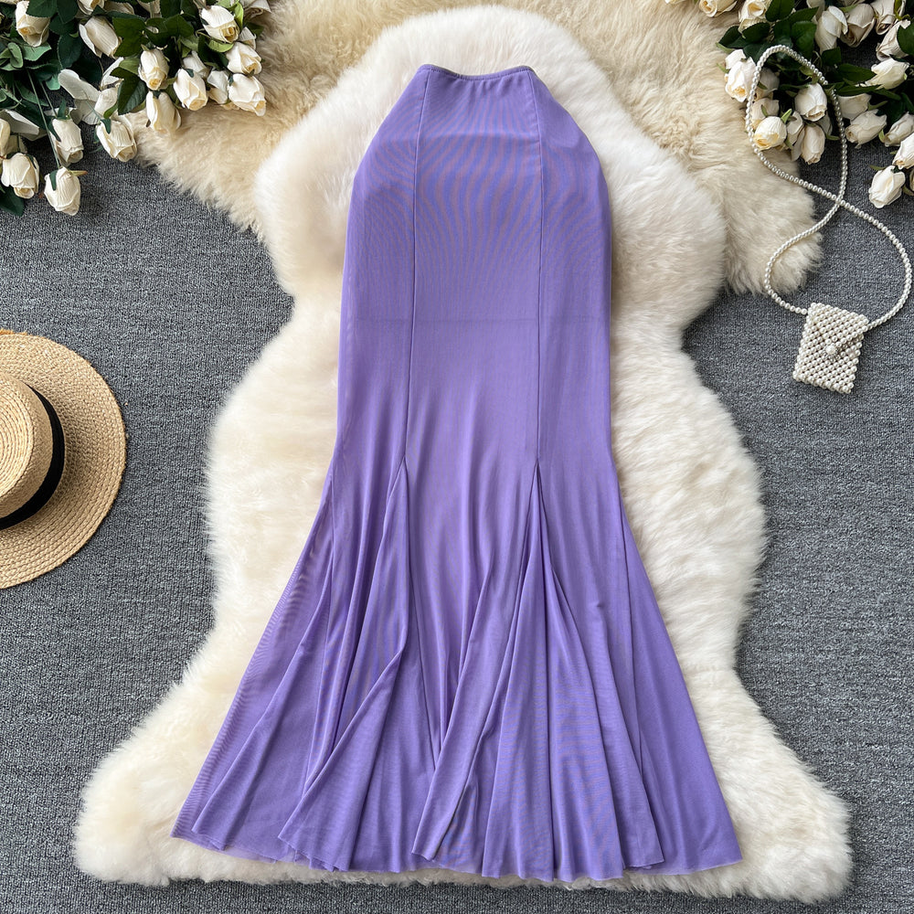High-end, sophisticated, and effortlessly chic: this versatile midi skirt is perfect for the modern woman's commute. featuring a stylish design with elastic detailing, a figure-flattering fit, and a trendy mesh and fishtail hem, this skirt is a must-have