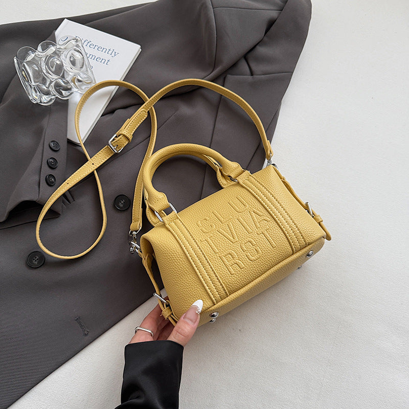 Fashion niche high-end sense embossed letter pillow bag 2025 new summer versatile color casual messenger bag