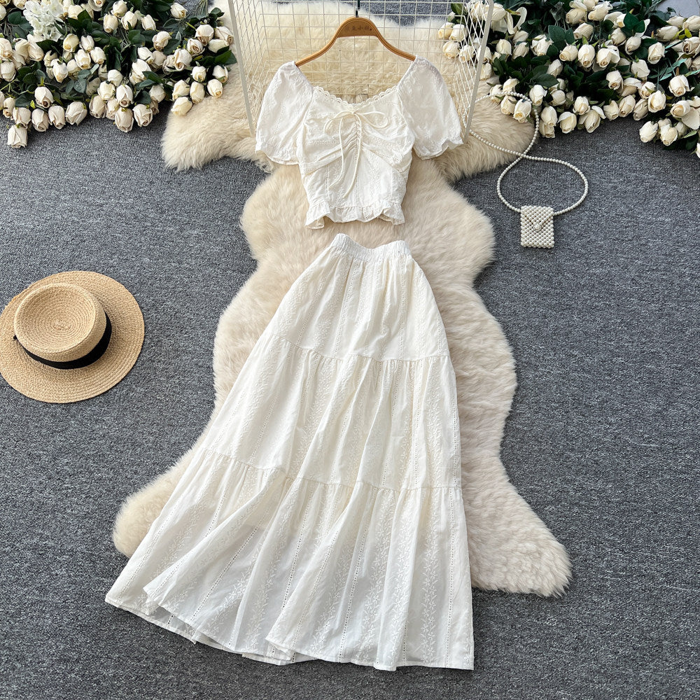Korean-inspired, stylish and chic women's two-piece set featuring a puff-sleeve, square-neck top and a high-waisted, figure-flattering midi skirt