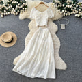 Korean-inspired, stylish and chic women's two-piece set featuring a puff-sleeve, square-neck top and a high-waisted, figure-flattering midi skirt