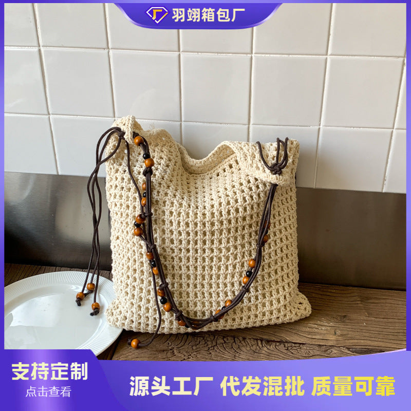 Cross-border niche design mesh bag hollow woven tote bag shoulder messenger bag 2025 new leisure style beach bag