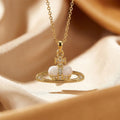 8434 white heart saturn gold necklace