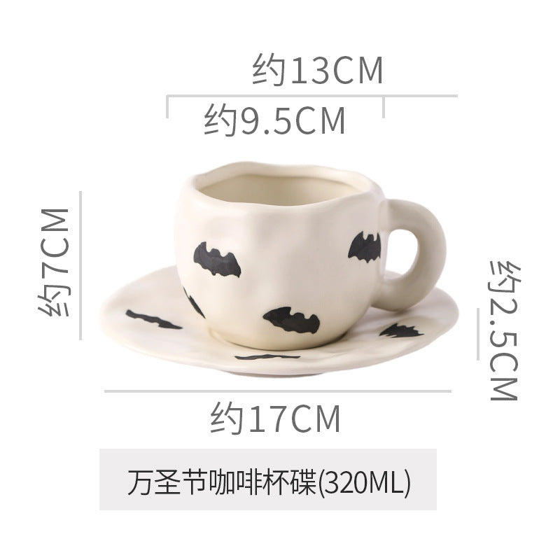 Creative halloween-themed ceramic cup and saucer set, featuring an irregular design with pumpkin and bat motifs. perfect for coffee or tea