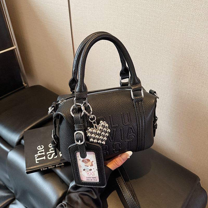 Fashion niche high-end sense embossed letter pillow bag 2025 new summer versatile color casual messenger bag