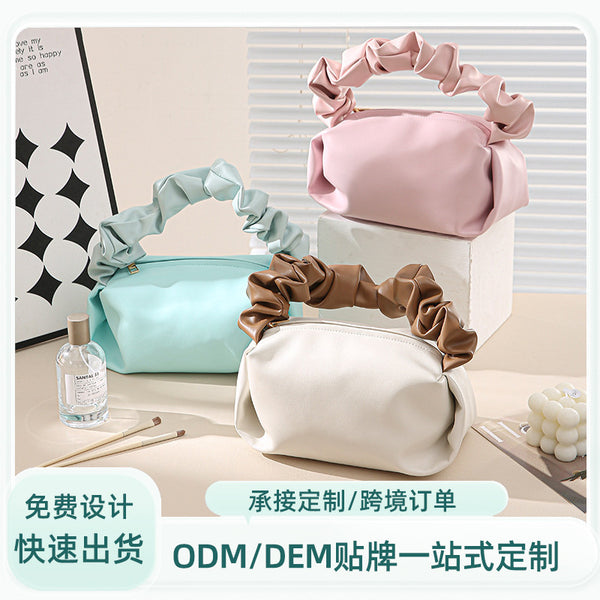 Customized manufacturer ins Internet celebrity solid color simple portable cloud bag niche texture pvc leather pleated women's cosmetic bag