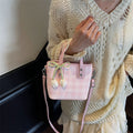 This year's trendy handbags for women: 2026 new arrivals featuring versatile plaid bucket bags, artistic floral shoulder bags, and crossbody bags