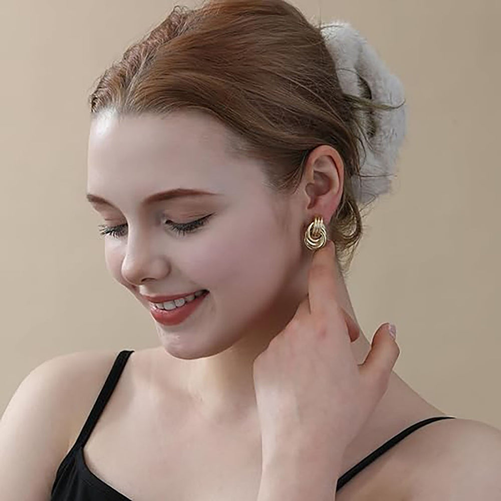 European and american cross-border amazon design new twisted knotted earrings oval hollow copper tube metal drop earrings jewelry