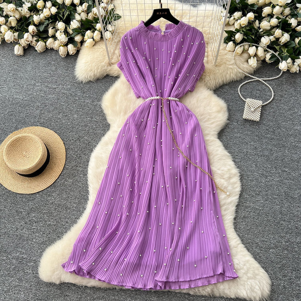 French-inspired v-neck floral chiffon dress with flared sleeves, tie waist, and a figure-flattering, vintage-inspired silhouette
