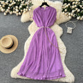 French-inspired v-neck floral chiffon dress with flared sleeves, tie waist, and a figure-flattering, vintage-inspired silhouette