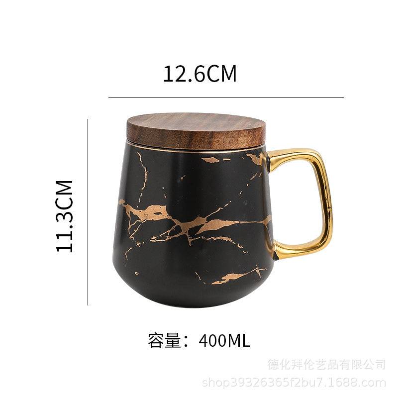 Nordic-inspired ceramic coffee mug, teacup, and saucer set with gold-traced marble pattern and wooden lid