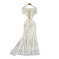 Luxury chic women's french-style one-shoulder bandeau dress with metal buckle, cinched waist, and flowing ribbon mesh detail