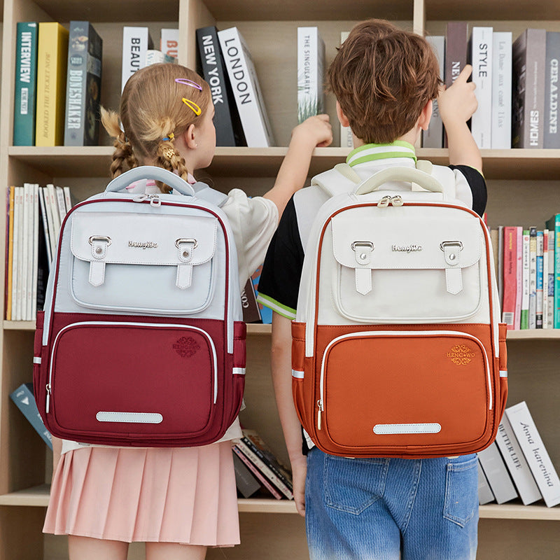 Student schoolbag large capacity kids burden reduction spine protection british style backpack factory direct sales lightweight anti-hunchback