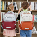 Student schoolbag large capacity kids burden reduction spine protection british style backpack factory direct sales lightweight anti-hunchback