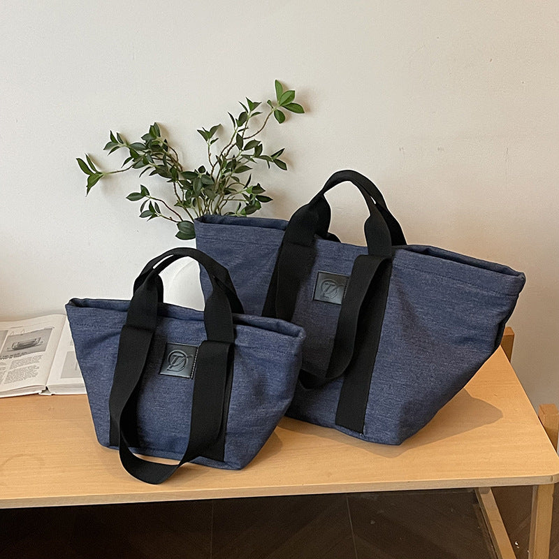 Casual large-capacity denim bag, women's 2025 new lightweight and versatile commuter shoulder bag, portable tote bag