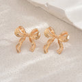 Bow earrings wholesale european and american cross-border metal earrings electroplated versatile women's simple fashion glossy elegant earrings