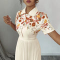 european and american new retro orange blossom patchwork shirt dress with turn-down collar, short sleeves, cinched waist, and long pleated skirt