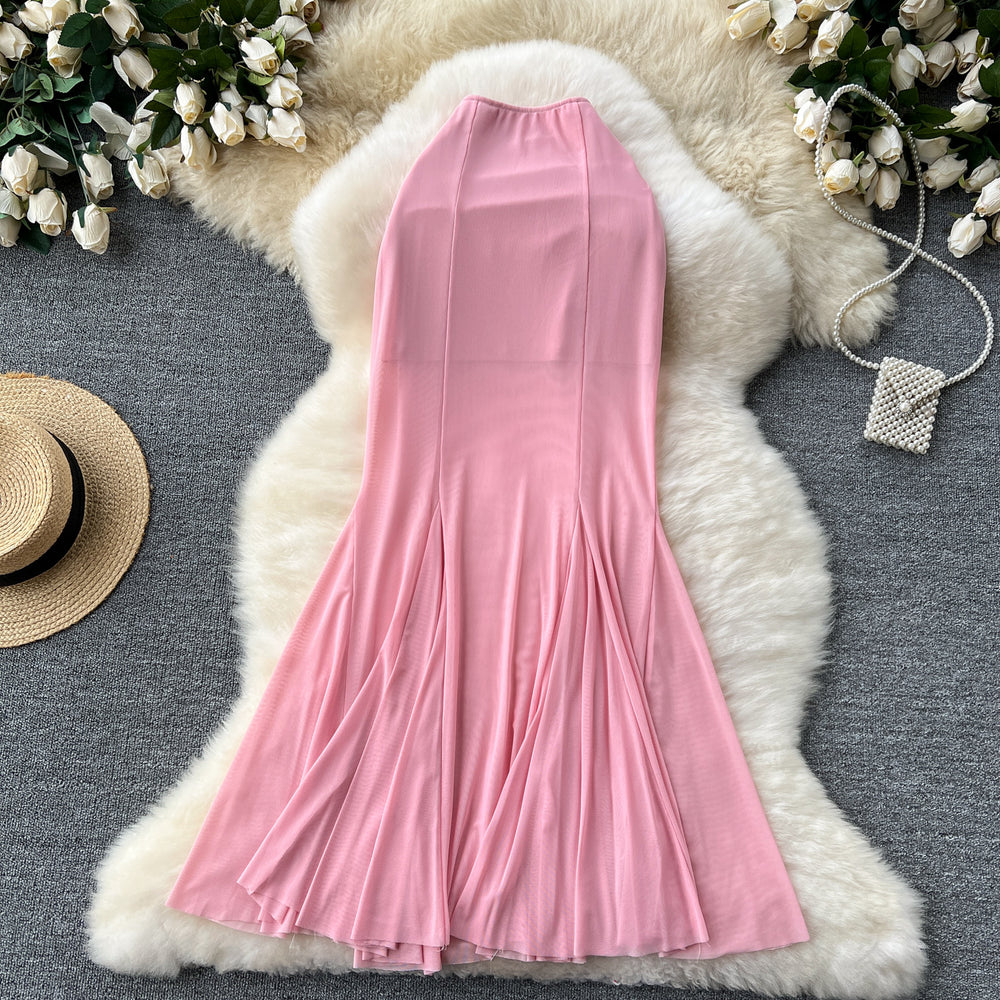 High-end, sophisticated, and effortlessly chic: this versatile midi skirt is perfect for the modern woman's commute. featuring a stylish design with elastic detailing, a figure-flattering fit, and a trendy mesh and fishtail hem, this skirt is a must-have