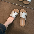 Fashionable starlight silver h strap versatile soft sole sandals & slippers - high-end french retro flat one-strap slides for women