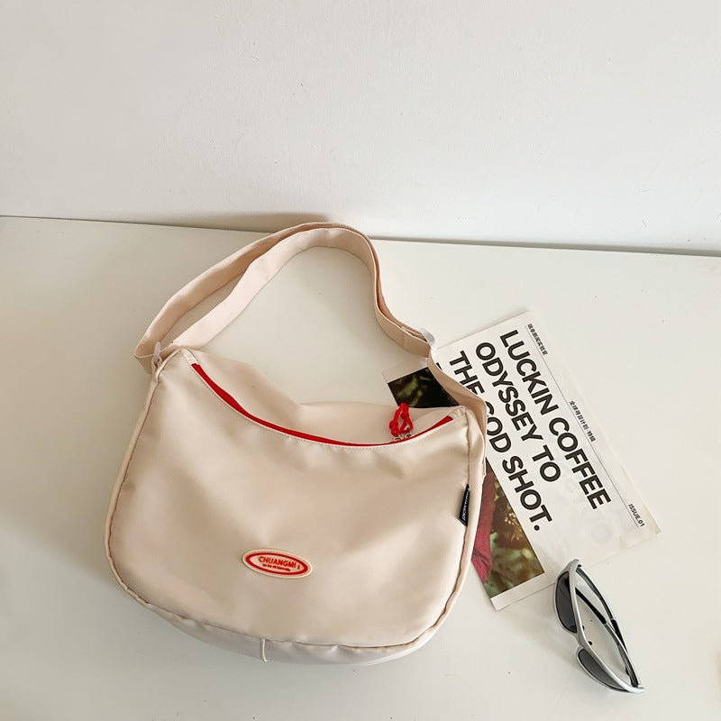 Foreign single nylon cloth bag women's large capacity 2025 new summer versatile shoulder messenger bag casual commuter dumpling bag