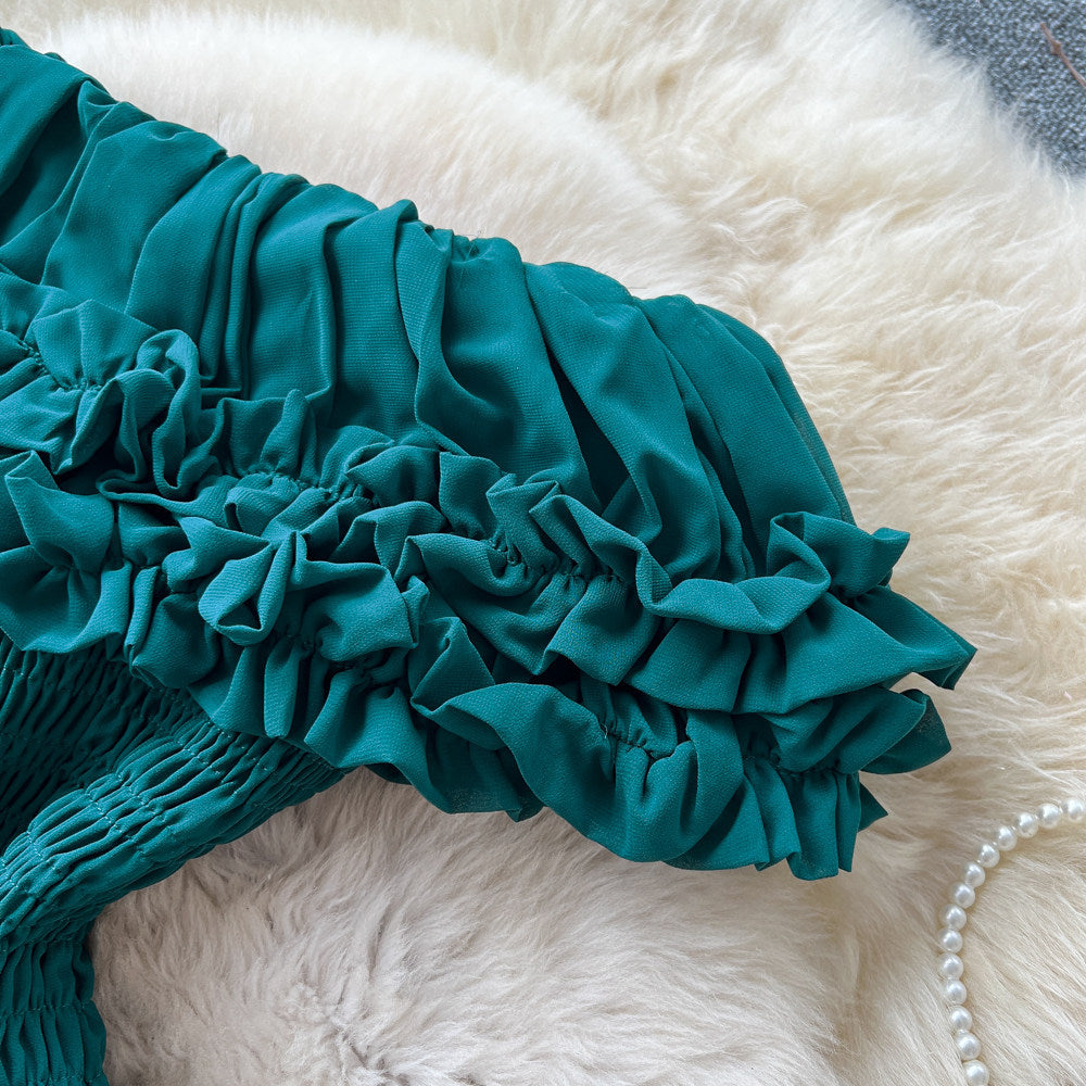 French-inspired, strapless, and stylish dress for women. high-waisted, slimming, and featuring a flattering ruffle hem. perfect for summer, this long, flowing dress comes in a chic green