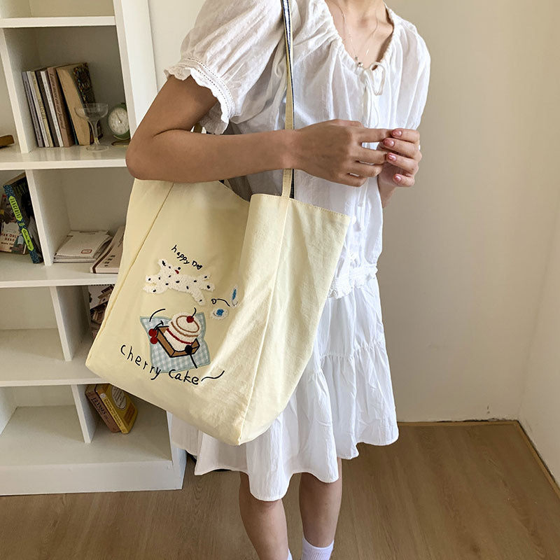 Canvas bag 2025 new women's handheld cloth bag large capacity carrying book bag junior high school students tutoring embroidered shoulder bag