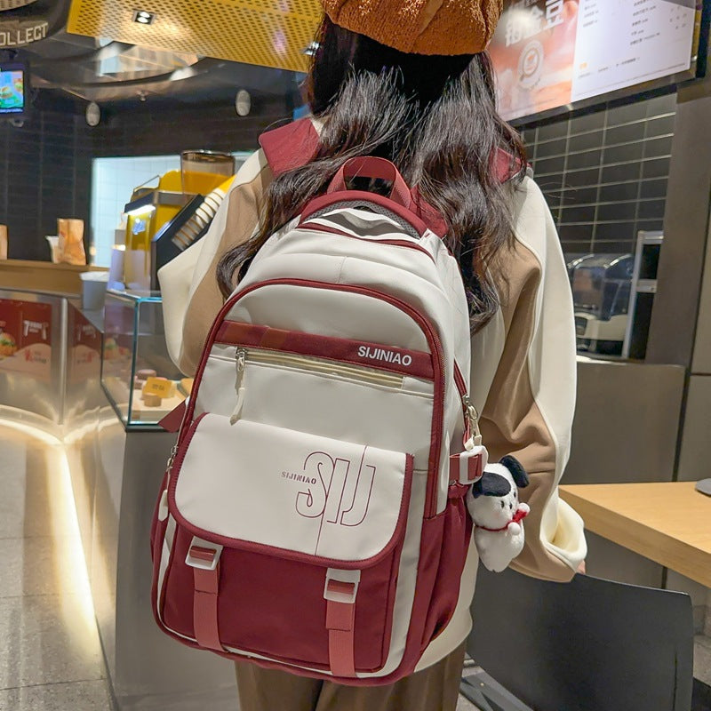 Large-capacity load reduction spine bag for female primary school students, junior high school students, high school students, college students, backpack for women 2023 new models