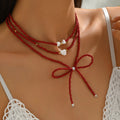 European and american cross-border red beaded bow necklace - luxury, unique design, stackable heart pearl jewelry necklace