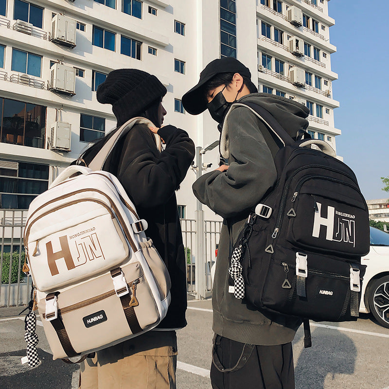 New backpack, junior high school, male and female students, campus schoolbag, large capacity, fashion trend, strong and durable leisure bag