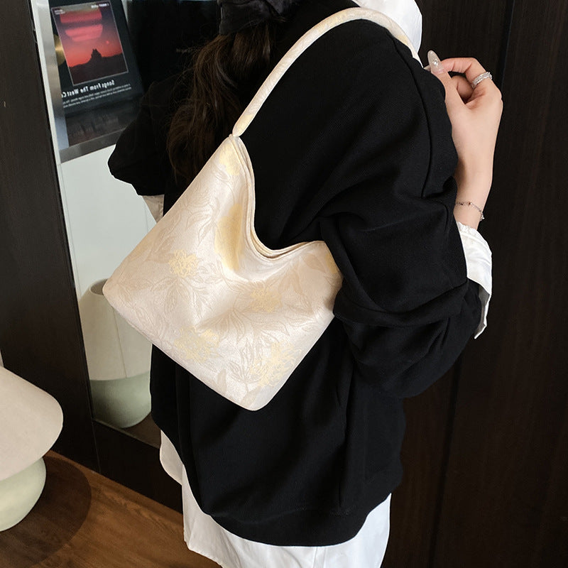 Fashion trend niche design bucket bag 2025 summer new foreign style casual texture women's shoulder messenger bag