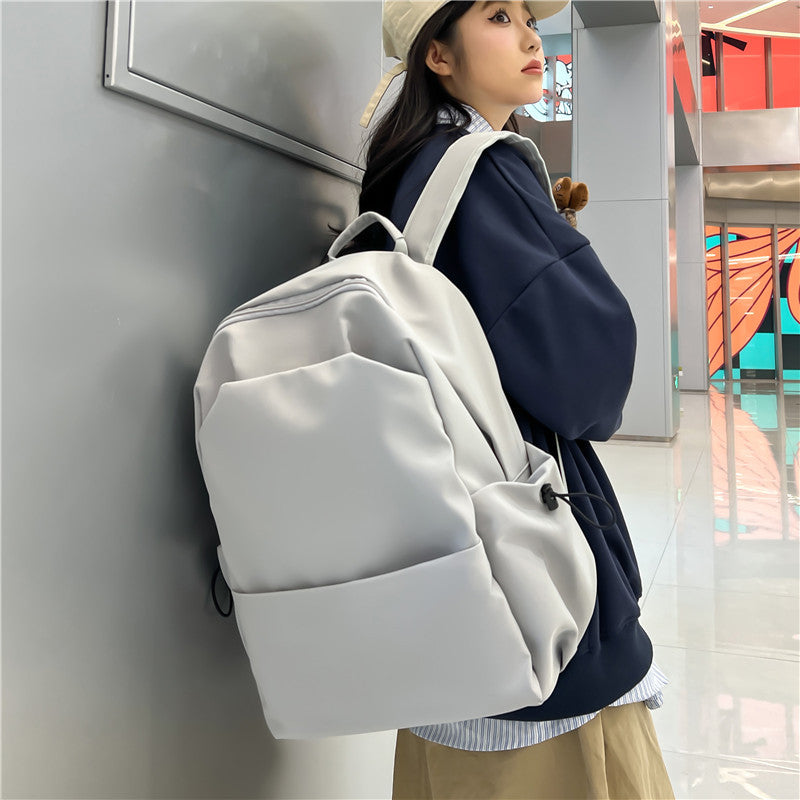 Campus Japanese backpack versatile male and female junior high school college student schoolbag solid color casual large capacity travel backpack