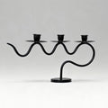 European retro minimalist wavy iron candle holder with electronic candles for a romantic ambiance in living room or dining table