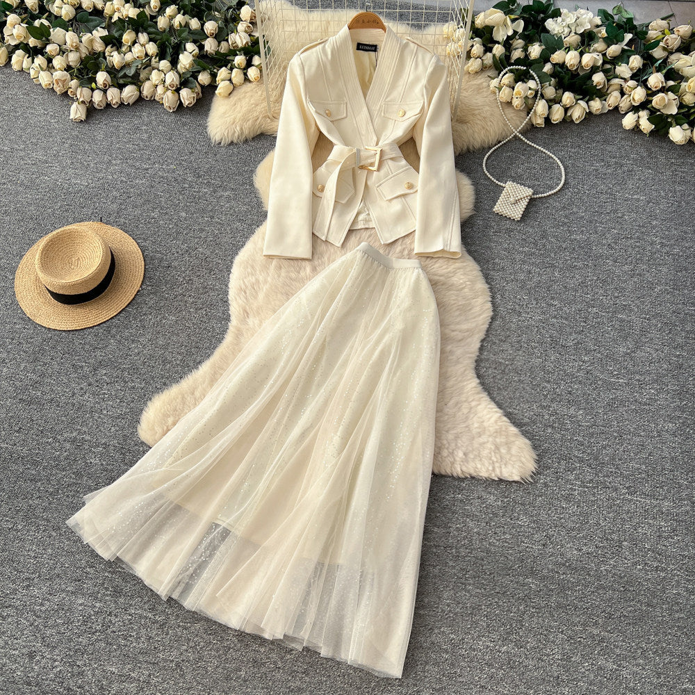 Elegant and chic chanel-inspired two-piece set: women's autumn outfit featuring a tie-waist cardigan and mesh skirt