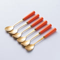 Orange gold spoon