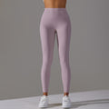 High-waisted, barely-there yoga pants for women, designed with a no-ride-up waistband for a seamless look. these figure-hugging, peach-shaped leggings offer a lift and a comfortable, stretchy fit, perfect for workouts and fitness activities. custom manufa