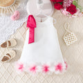 girls' solid color sleeveless party dress with 3d floral hem and bow detail