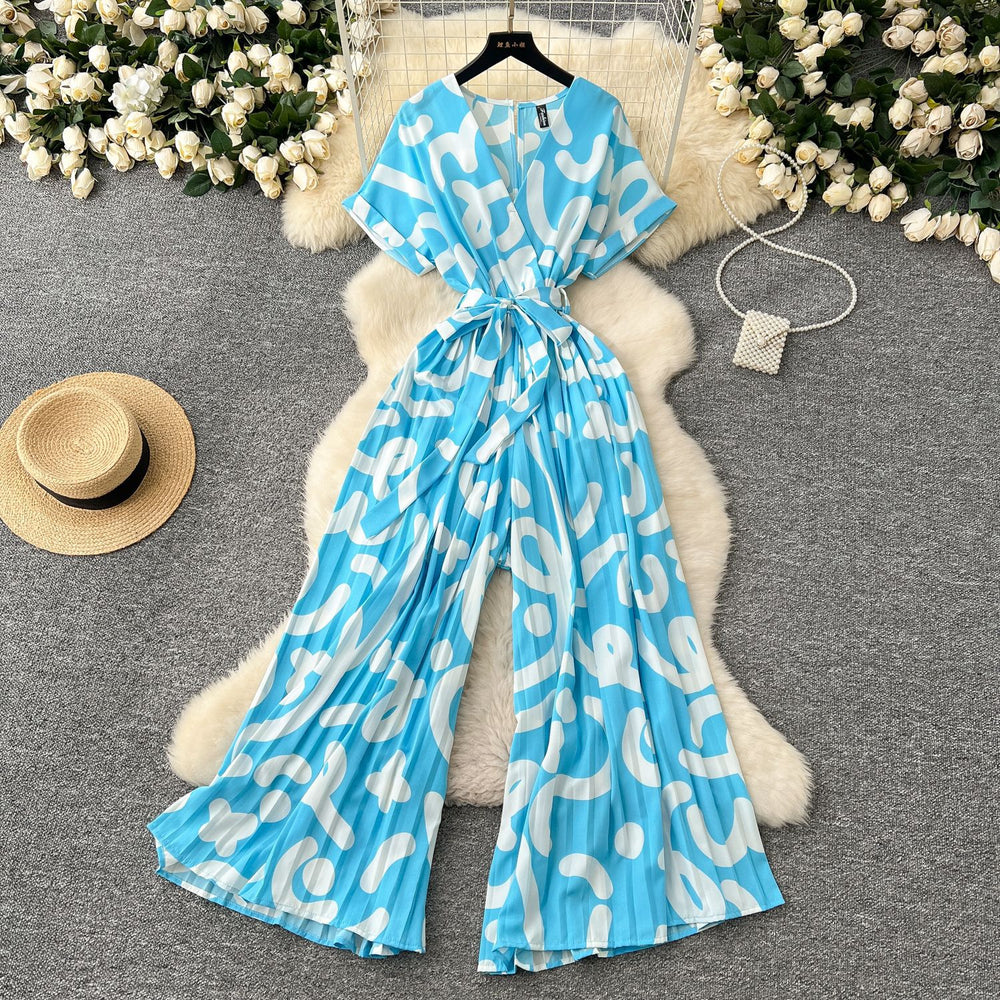 Fashion ins style vacation beach pants women's new style light mature niche stylev neck short sleeve strap looseprinting jumpsuit
