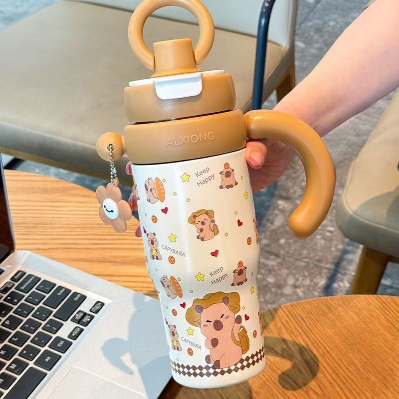 High-style 316 stainless steel insulated tumbler, perfect for outdoor use. portable, large-capacity design with a handle and straw, ideal for kids