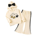 Girls' autumn outfit: beige hooded sweatshirt with cartoon print and bow detail, paired with flared pants
