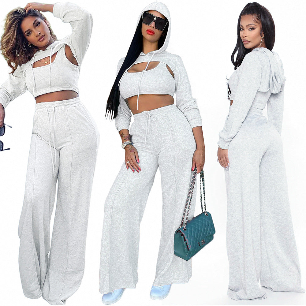 S391419 Cross-border explosive wholesale European and American casual hooded hollow sweater solid color suspender trousers three-piece set women