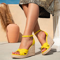 Yellow faux suede wedge sandals with braided rope platform, bow accent, and ankle strap – stylish women's footwear for vacation