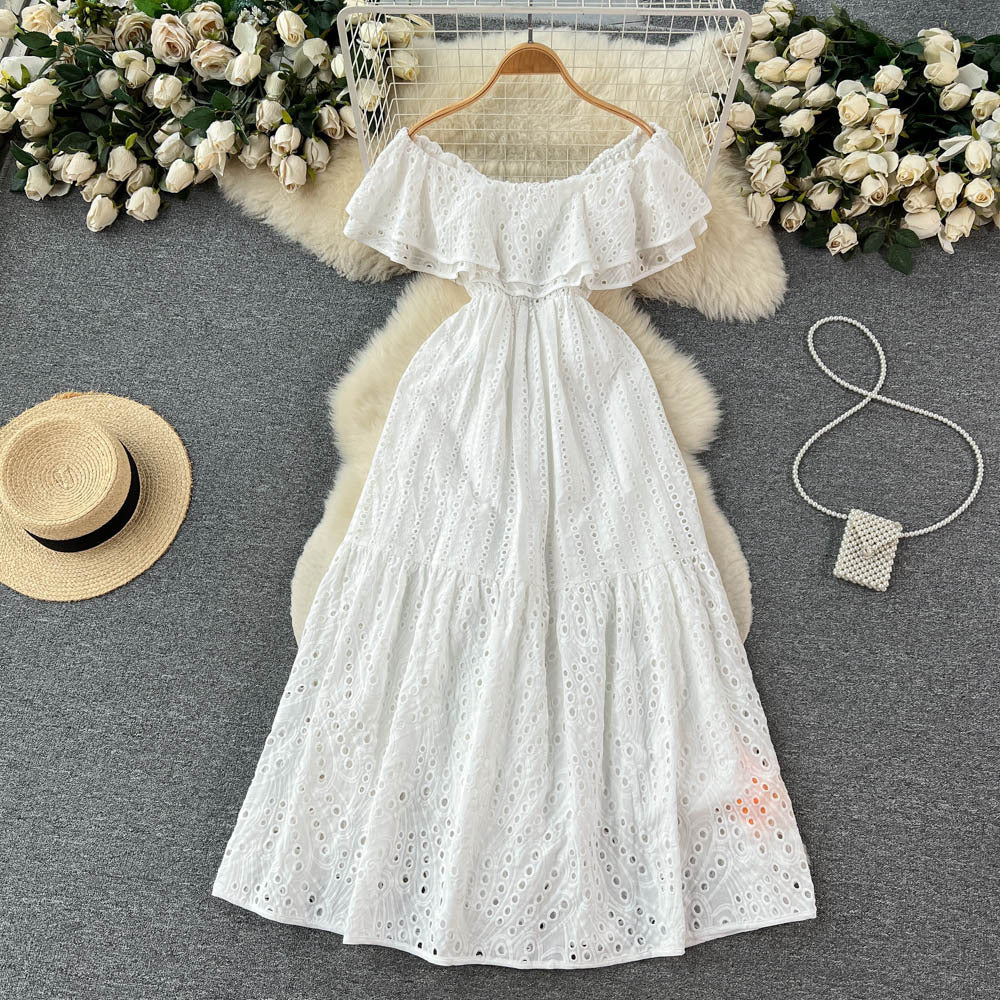 Elegant, sophisticated, and effortlessly chic: this ruffled, off-the-shoulder, lace-embroidered, and cutout maxi dress is perfect for a glamorous beach vacation