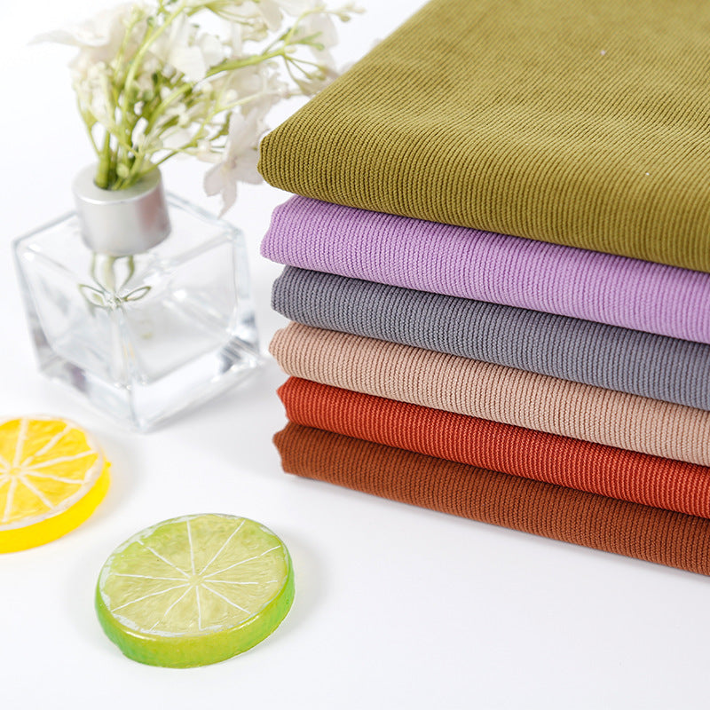 Warp knitted elastic 21 corduroy fabric 21 pit thin polyester corduroy luggage sofa throw pillow clothing fabric