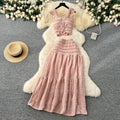 Age-reducing fresh spring and summer holiday style short small flying sleeve suspender tops + high waist pleated skirt two-piece set