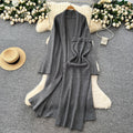 Minimalist solid color knitted mature woman's winter set: slim-fit bandeau dress with long cardigan coat