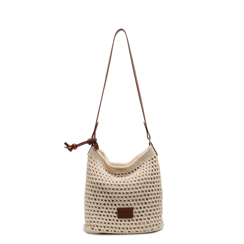 Holiday knitted bag women's 2025 summer new commuter shoulder messenger bag hollow woven bucket bag wholesale