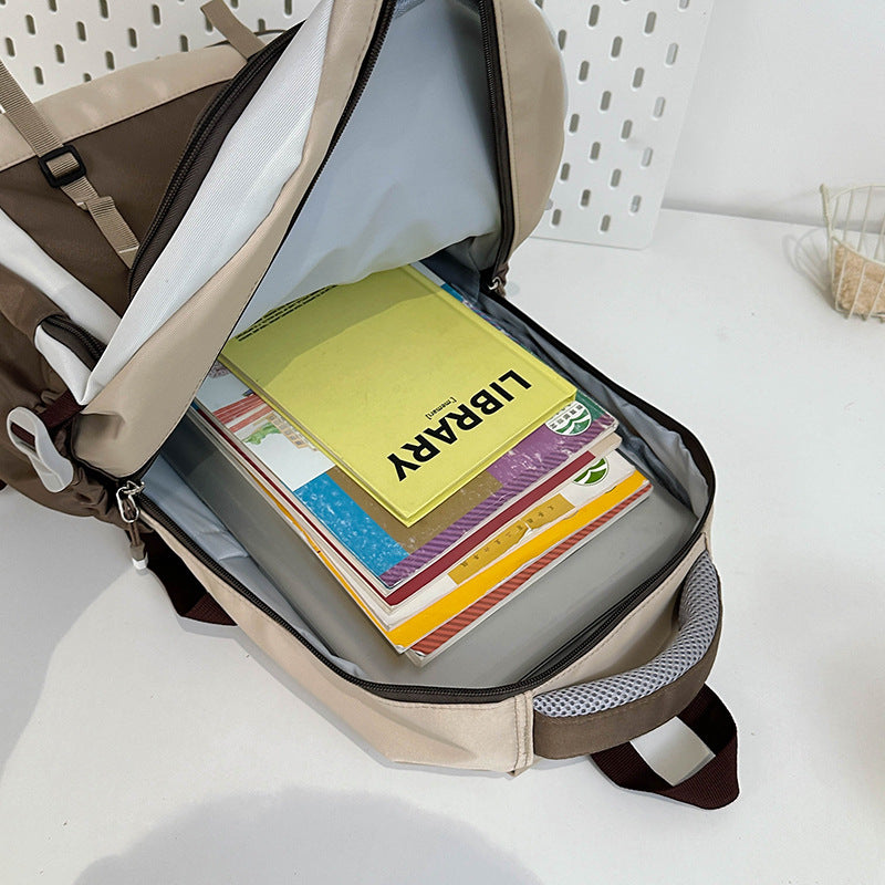School bag female primary school students large-capacity contrasting color simple Japanese backpack 2025 new junior high school travel backpack
