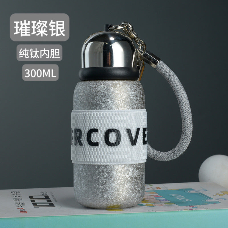 Titanium-plated thermos cup, titanium-plated high-end light luxury portable water cup, ladies' high-looking double-layer flap pocket pants cup, mini titanium gift box