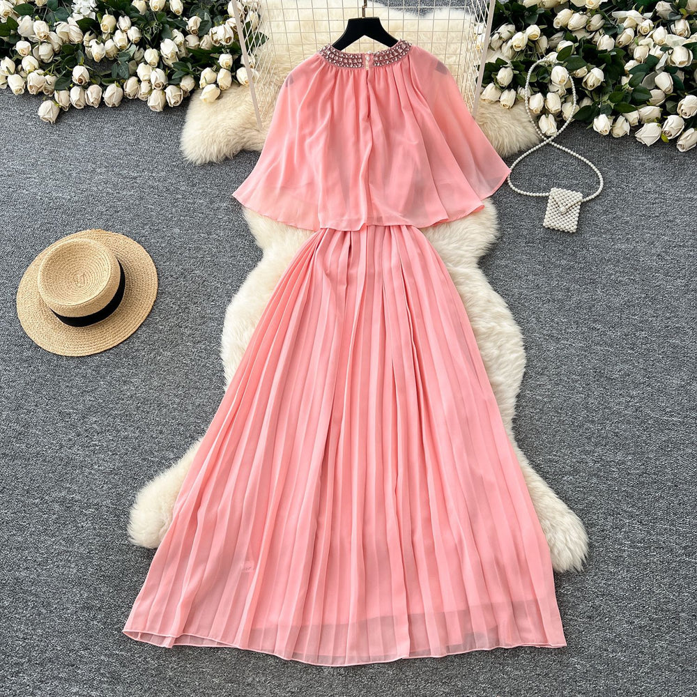 French-style, heavily embellished, beaded and rhinestone-studded, round-neck shawl dress with tie-waist detailing. features a flattering, slimming silhouette and elegant pleated chiffon