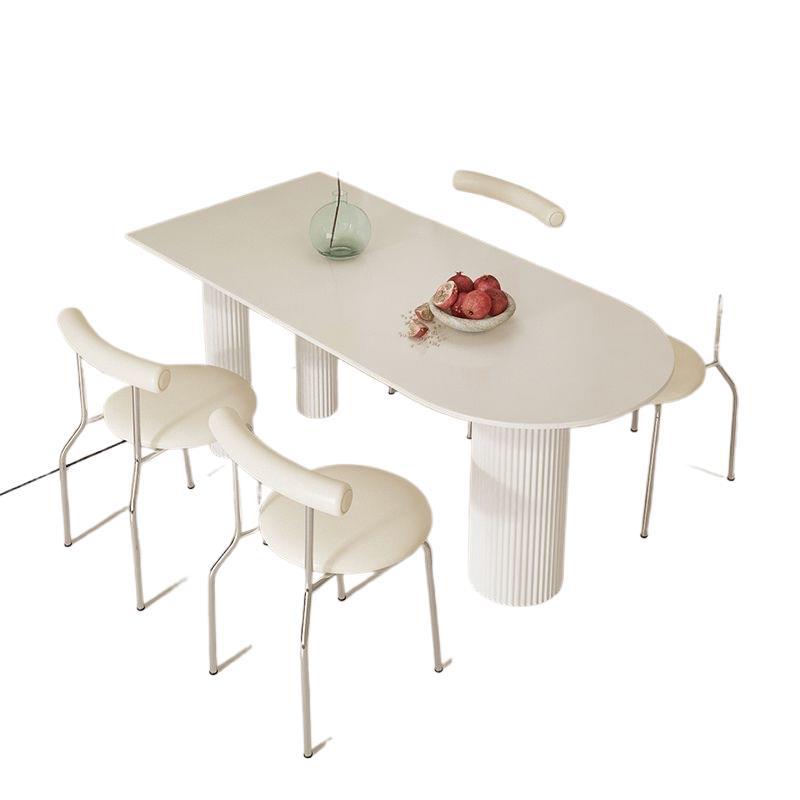 Creamy white rock slab dining table and chair set - modern minimalist semi-circular dining table for small spaces